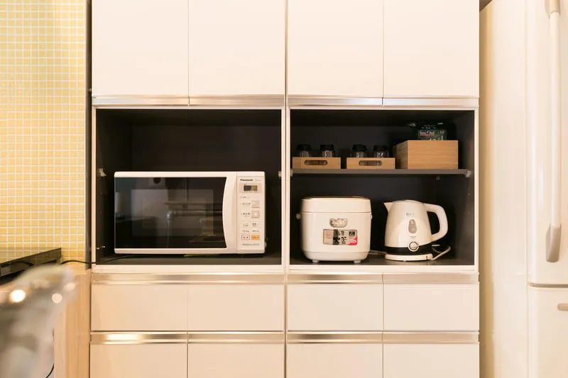 Microwave, rice cooker and kettle in the kitchen