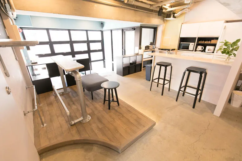 Shared kitchen with a bar counter and stools